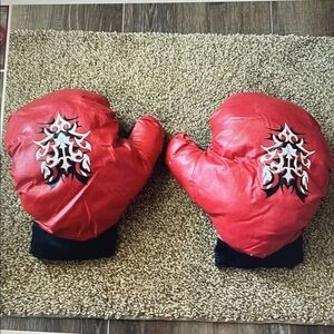 Red padded boxing gloves